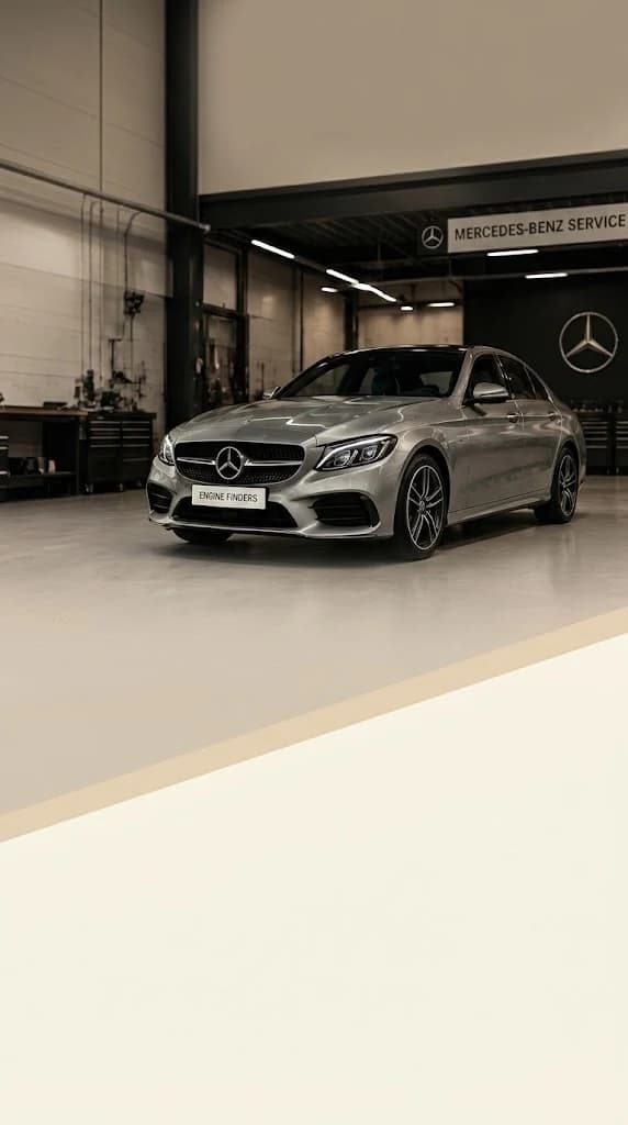 Land Rover C-Class in a bright Land Rover specialist workshop